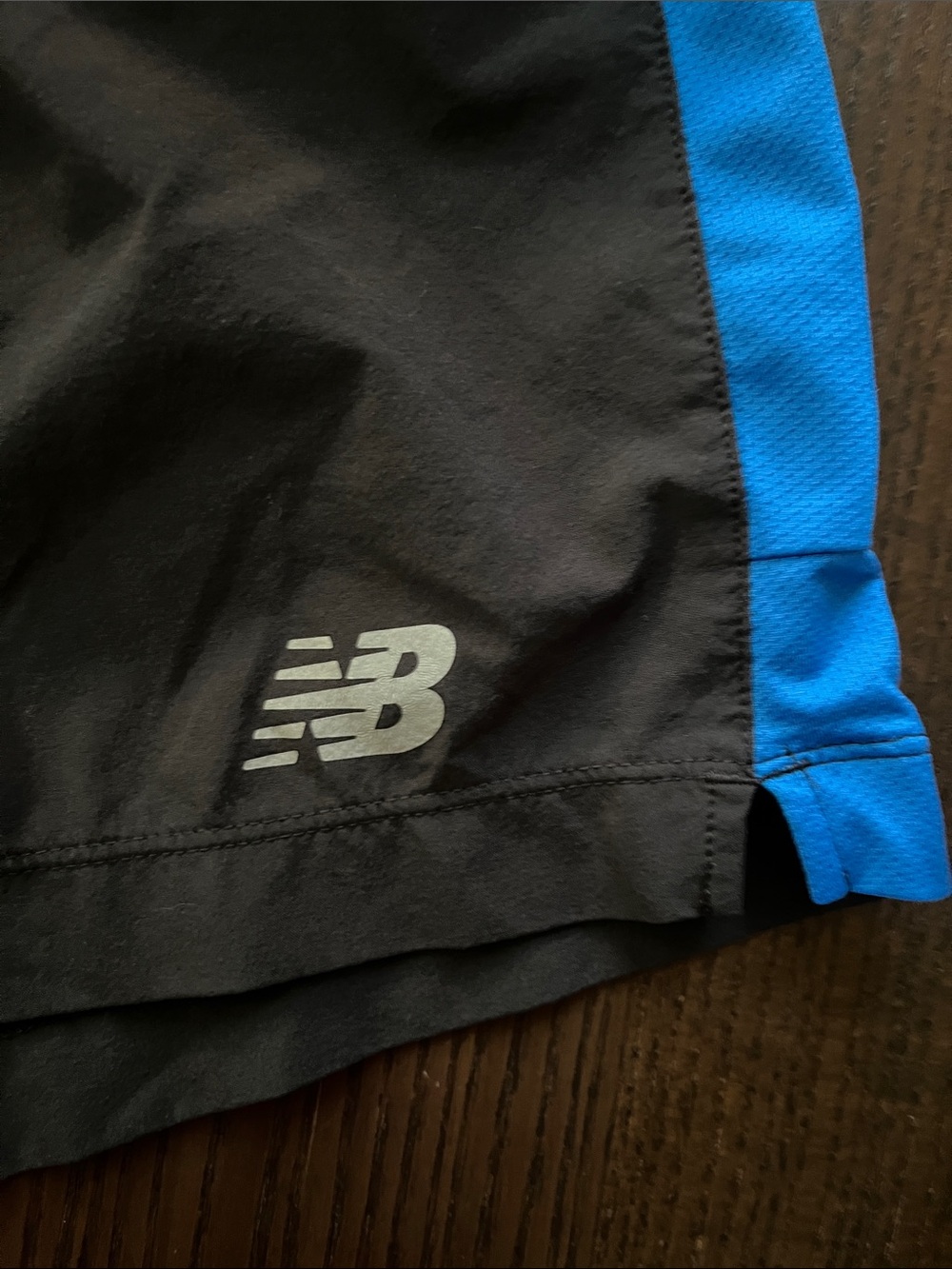 New Balance Black Athletic Shorts with Blue Side Panels